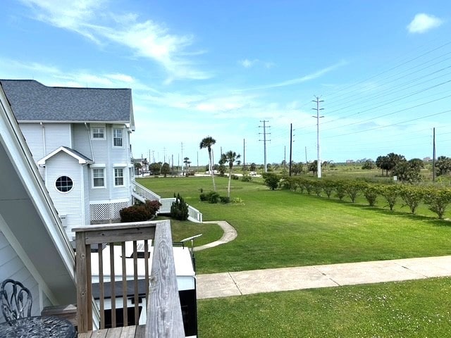 12924 Stewart Rd, Galveston, TX 77554 - view of grassy yard featuring stairs