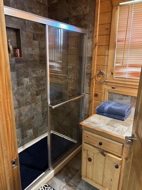bathroom featuring a shower stall