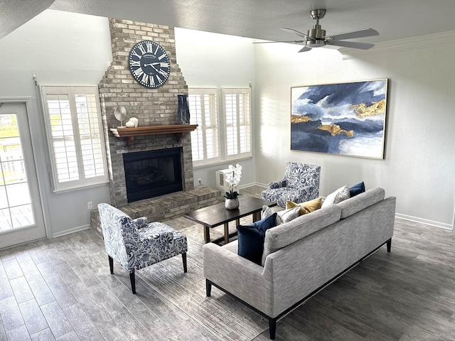 12924 Stewart Rd, Galveston, TX 77554 - living room featuring wood finished floors, a ceiling fan, baseboards, a fireplace, and vaulted ceiling