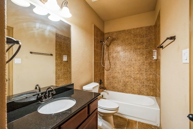 full bath featuring a textured wall, washtub / shower combination, vanity, and toilet