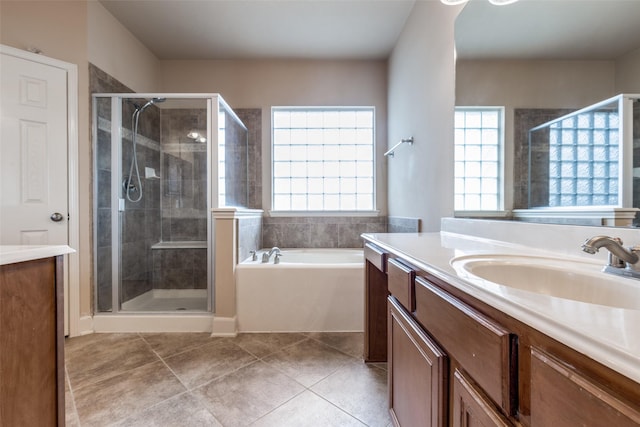full bathroom with vanity, tile patterned flooring, and a stall shower