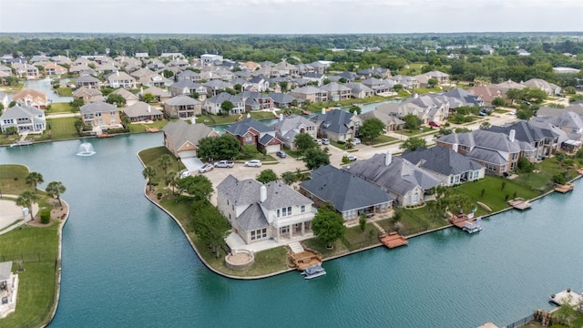 birds eye view of property with a residential view and a water view