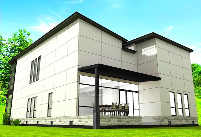 exterior space with stucco siding and a yard