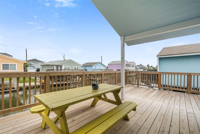 wooden terrace with a residential view