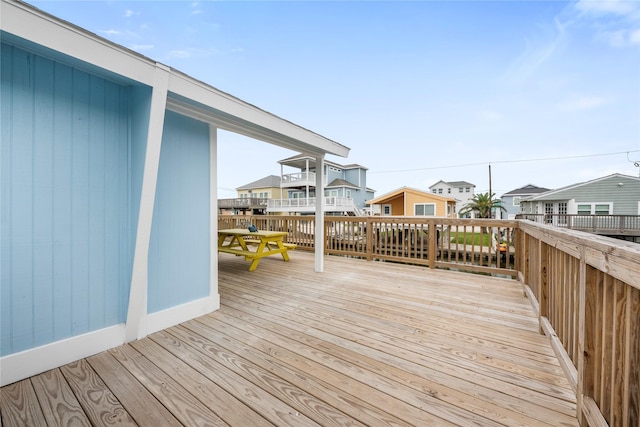 wooden terrace featuring a residential view