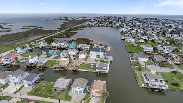 birds eye view of property with a residential view and a water view