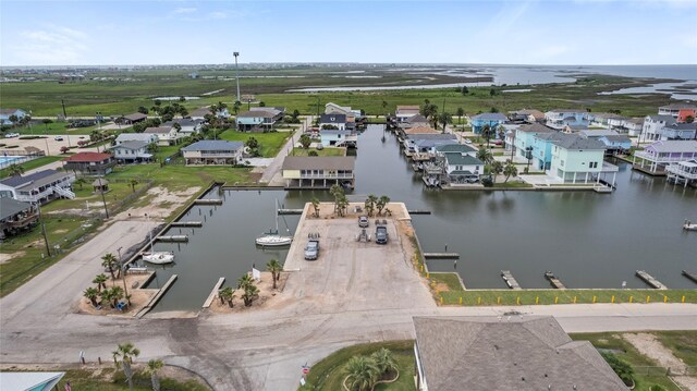 birds eye view of property with a residential view and a water view