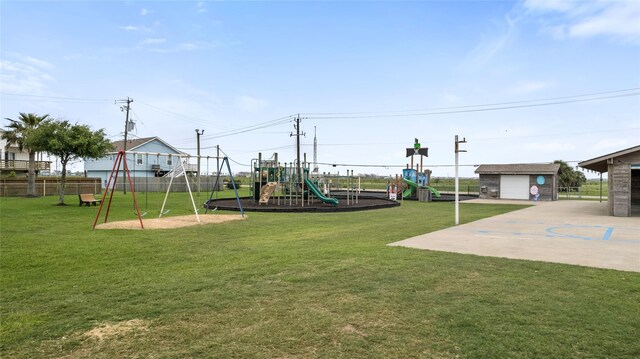 communal playground featuring fence and a yard