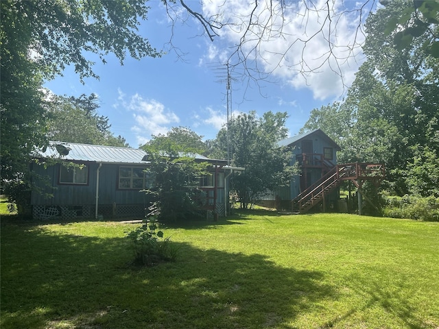 381 Lakeshore Dr, Cleveland, TX 77327 - view of yard with stairway and a deck
