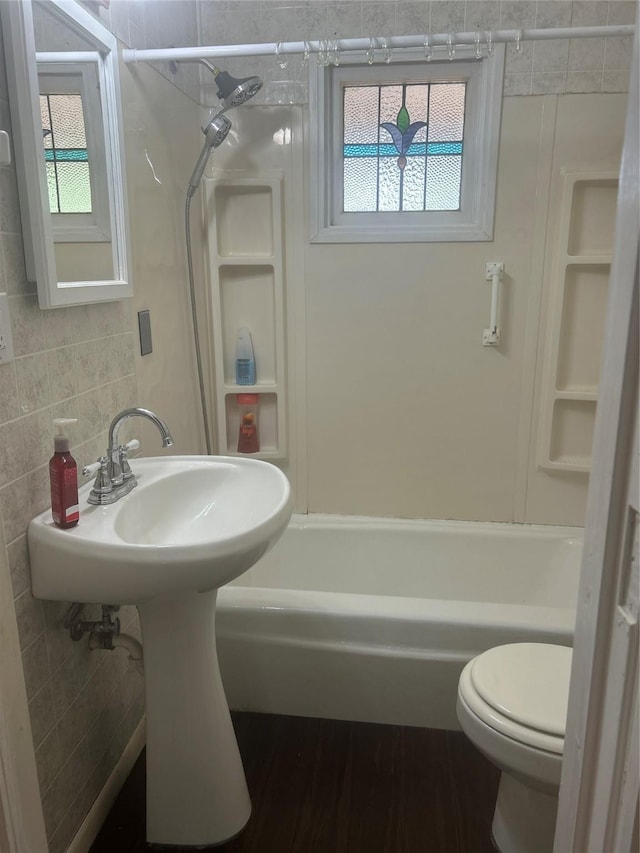 381 Lakeshore Dr, Cleveland, TX 77327 - bathroom featuring plenty of natural light, shower / tub combination, and toilet