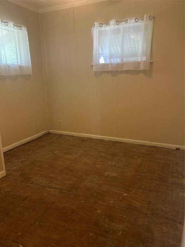 381 Lakeshore Dr, Cleveland, TX 77327 - spare room with wood finished floors, baseboards, and ornamental molding