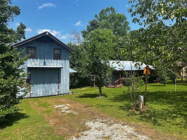 381 Lakeshore Dr, Cleveland, TX 77327 - view of yard with driveway and an outdoor structure