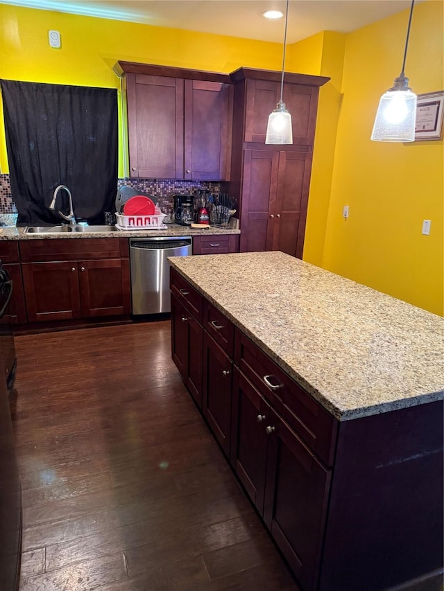4212 Knoxville St, Houston, TX 77051 - kitchen with stainless steel dishwasher, a sink, decorative backsplash, reddish brown cabinets, and dark wood-type flooring