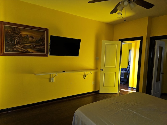 4212 Knoxville St, Houston, TX 77051 - bedroom featuring baseboards, a ceiling fan, and dark wood-style floors