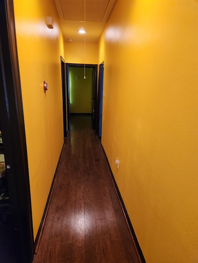 4212 Knoxville St, Houston, TX 77051 - hallway with attic access, baseboards, and dark wood-style flooring