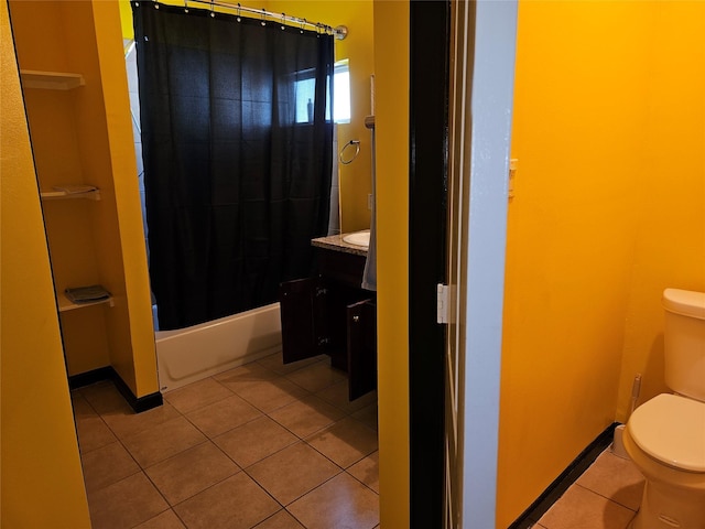 4212 Knoxville St, Houston, TX 77051 - full bathroom featuring shower / bath combo, toilet, baseboards, tile patterned flooring, and vanity