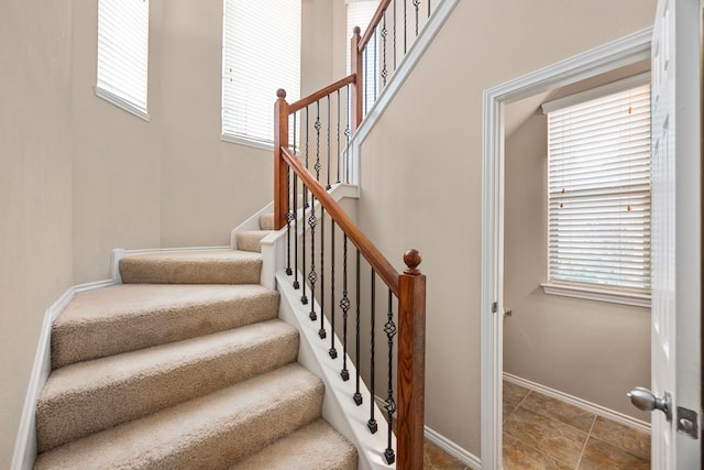 stairway featuring baseboards