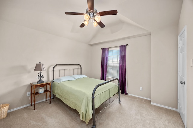 bedroom with carpet floors, lofted ceiling, and baseboards