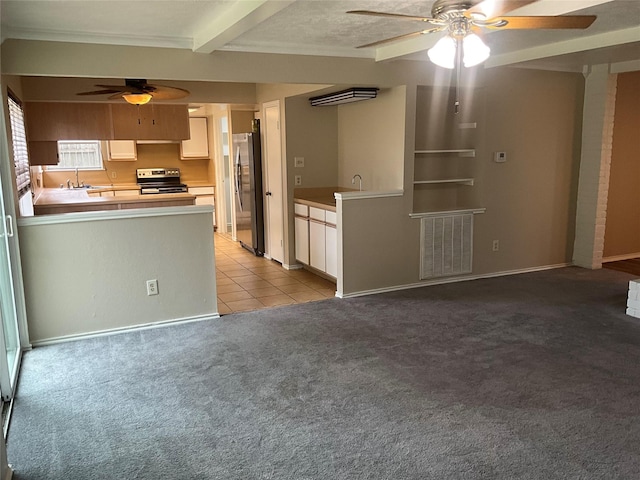 kitchen with ceiling fan, light colored carpet, a peninsula, appliances with stainless steel finishes, and visible vents