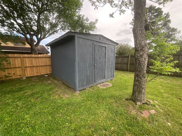 view of shed featuring a fenced backyard