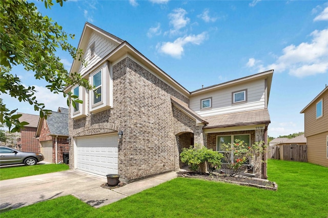 traditional-style house featuring a front lawn, concrete driveway, fence, a garage, and brick siding