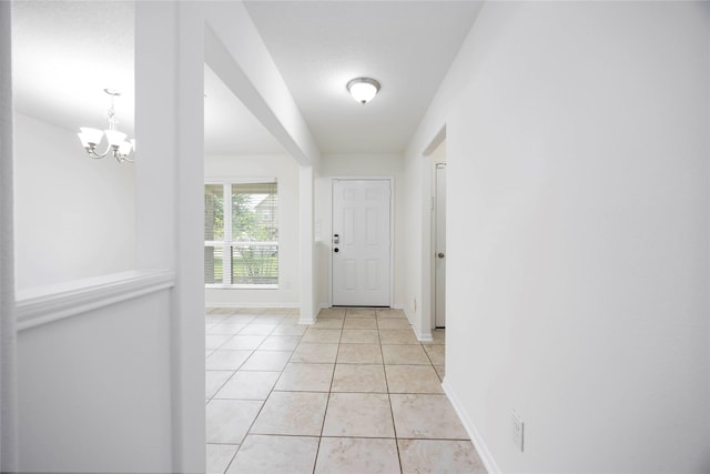 9939 Chimney Swift Ln, Conroe, TX 77385 - entryway featuring a chandelier and light tile patterned floors