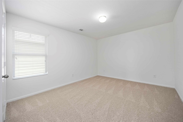 9939 Chimney Swift Ln, Conroe, TX 77385 - spare room with light colored carpet