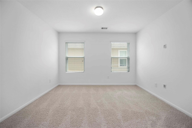 9939 Chimney Swift Ln, Conroe, TX 77385 - unfurnished room featuring light colored carpet and healthy amount of natural light