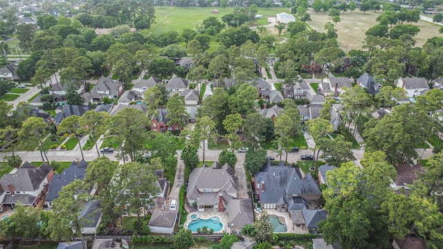 birds eye view of property with a residential view