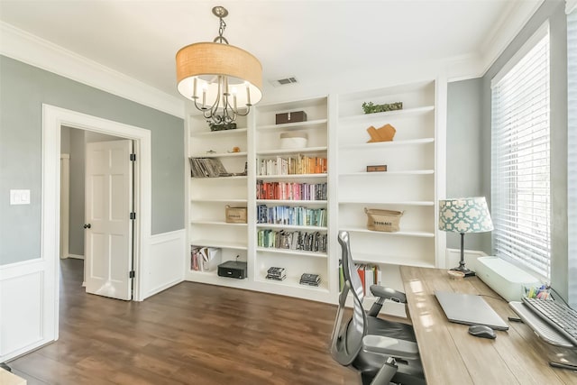 interior space with plenty of natural light, wood finished floors, an inviting chandelier, and ornamental molding