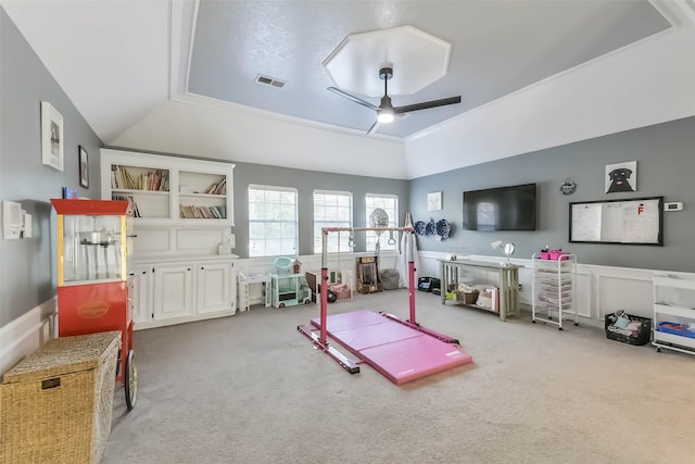 recreation room with lofted ceiling, a ceiling fan, visible vents, and carpet