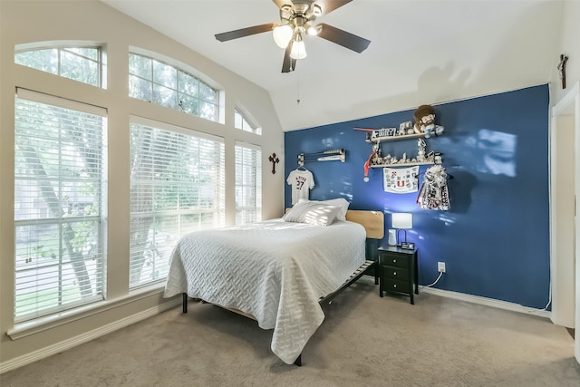 bedroom with lofted ceiling, a ceiling fan, baseboards, and carpet floors