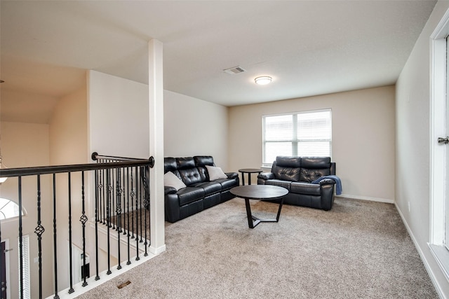 carpeted living room featuring baseboards and visible vents