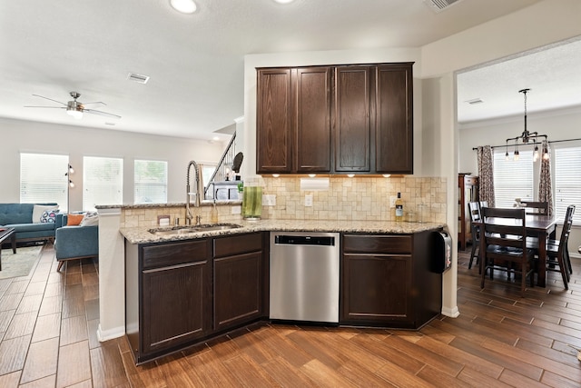 kitchen featuring a ceiling fan, dark brown cabinets, a sink, dishwasher, and dark wood-style floors