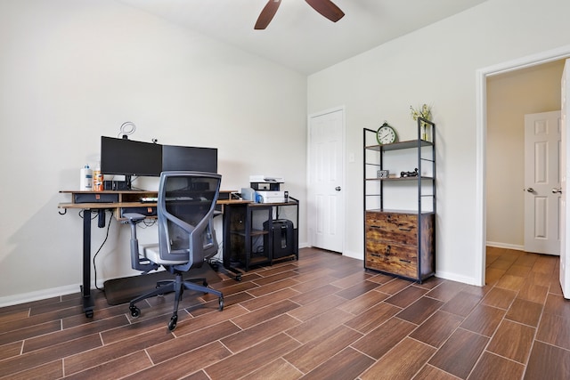 office featuring wood finish floors, a ceiling fan, and baseboards