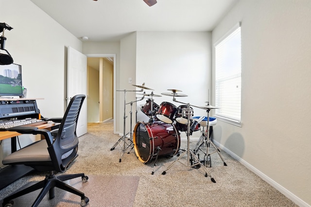 office featuring carpet, baseboards, and ceiling fan