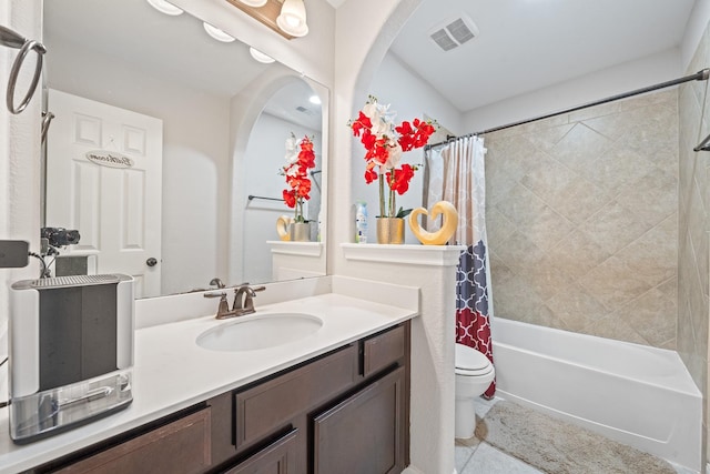 full bath featuring tile patterned floors, visible vents, toilet, vanity, and shower / bath combo