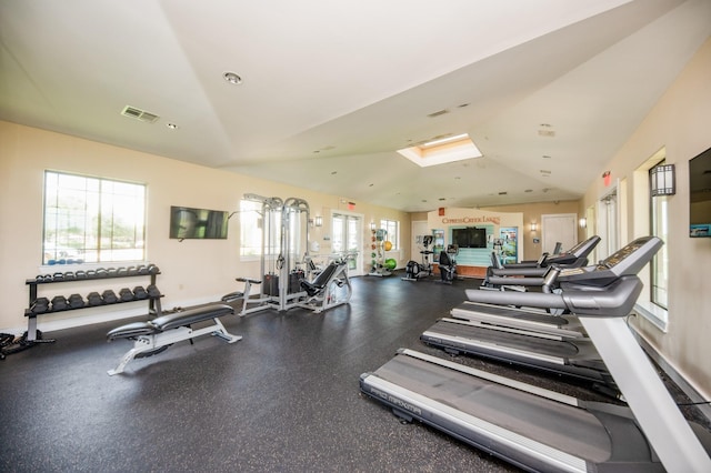 workout area with lofted ceiling and visible vents