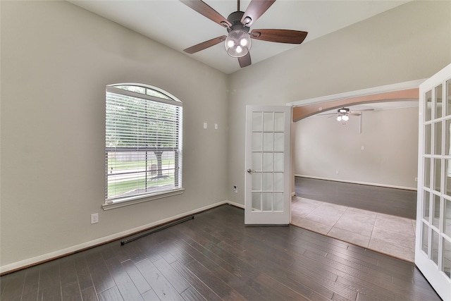unfurnished room featuring ceiling fan, baseboards, french doors, and wood finished floors