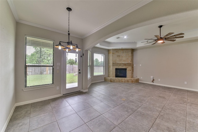 unfurnished living room featuring a stone fireplace, crown molding, baseboards, and light tile patterned floors