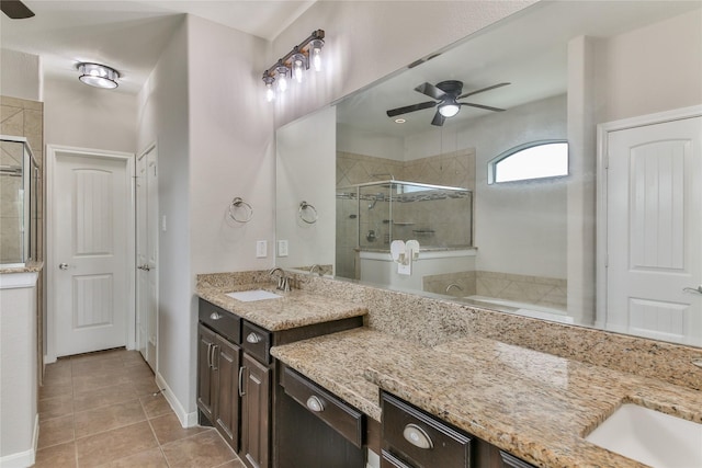 full bathroom featuring tile patterned flooring, vanity, a ceiling fan, and a stall shower