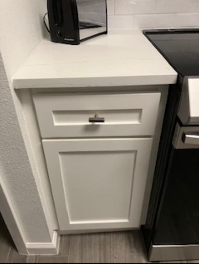 2800 Jeanetta St Unit 2104, Houston, TX 77063 - details with range and light countertops