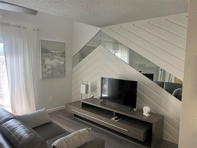 2800 Jeanetta St Unit 2104, Houston, TX 77063 - living room featuring baseboards, wood finished floors, and a textured ceiling