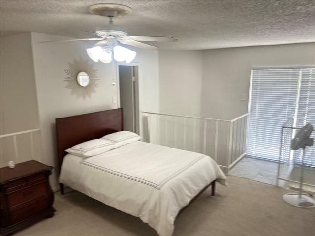 2800 Jeanetta St Unit 2104, Houston, TX 77063 - bedroom featuring ceiling fan, a textured ceiling, and light colored carpet