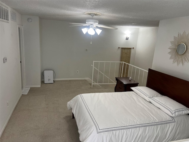 2800 Jeanetta St Unit 2104, Houston, TX 77063 - carpeted bedroom with baseboards, a textured ceiling, and visible vents