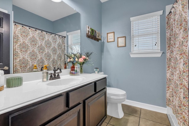 bathroom featuring tile patterned floors, a shower with curtain, toilet, baseboards, and vanity