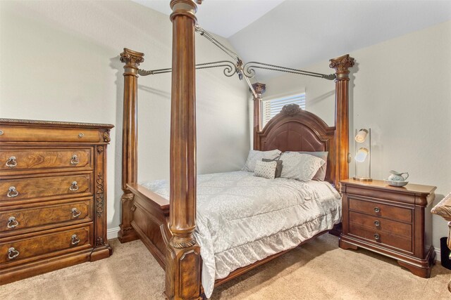 7407 Tudor Heights Ln, Spring, TX 77379 - bedroom featuring light carpet and vaulted ceiling