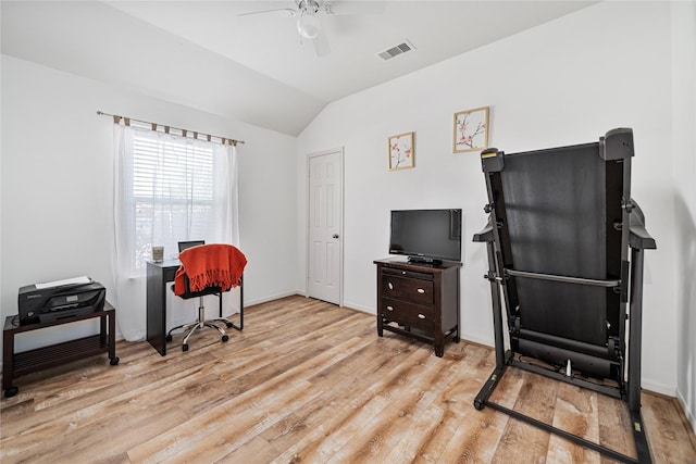 sitting room featuring lofted ceiling, wood finished floors, visible vents, a ceiling fan, and baseboards