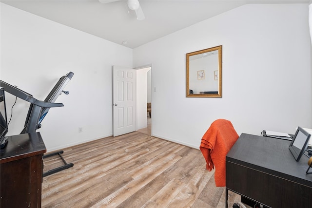 office space featuring ceiling fan, baseboards, and wood finished floors