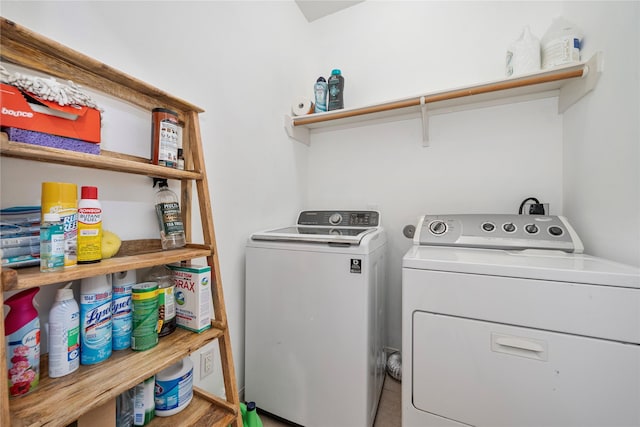 laundry area featuring washer and dryer and laundry area